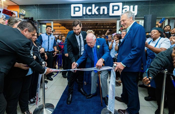 Pick n Pay founder Raymond Ackerman and store manager Bertie Carstens cut the ribbon at the Pick n Pay Waterstone opening. Store: Supplied