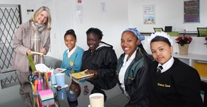 Teacher Kathryn Couzens assists (left to right) Andrew-Lee Ninon, a grade eight learner at Axios School of Skills; Natalie Lange, a grade 12 learner at Gordon High School; Micaela Jackson, in grade 12 at Gordon High School; and Chanelle Jonkers, grade eight at Gordon High School.