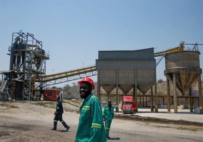 Workers are seen near a processing plant at the Dorowa mine in Hwedza, Zimbabwe. Source: Reuters/Philimon Bulawayo