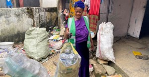 Nigerians trade waste material for health insurance