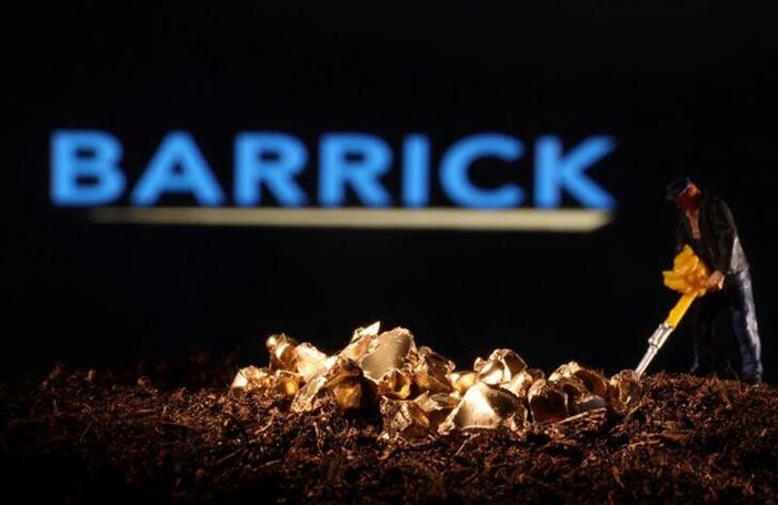 A small toy figure and gold imitation are seen in front of the Barrick logo. Source: Reuters/Dado Ruvic