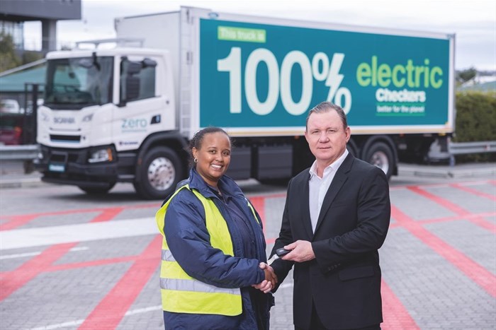 Source: Supplied | Truck driver Robin Jooste receives the keys to the Shoprite Group’s first electric truck from CEO Pieter Engelbrecht.