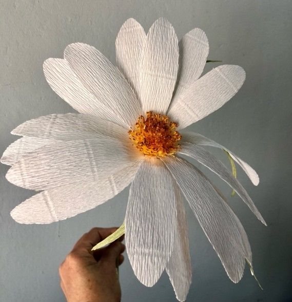 A close up of a daisy made by Cape Town-based MiaBella Paper Flower Couture and Create Studio.