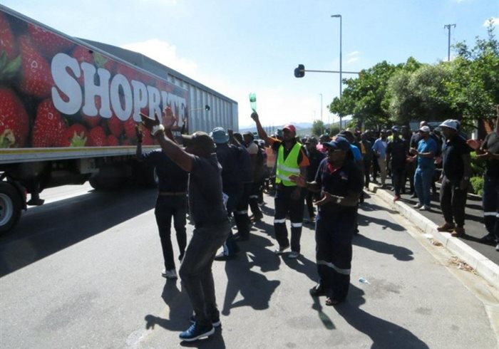 Truck drivers employed by Shoprite protest outside its distribution centre in Brackenfell, Cape Town, demanding a fixed basic salary and transport allowance. Photo: Vincent Lali. Source: GroundUp