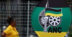 Source: Reuters. A delegate stands near a banner during the 55th national conference of the ruling African National Congress (ANC) at the Nasrec Expo Centre in Johannesburg, 18 December, 2022.