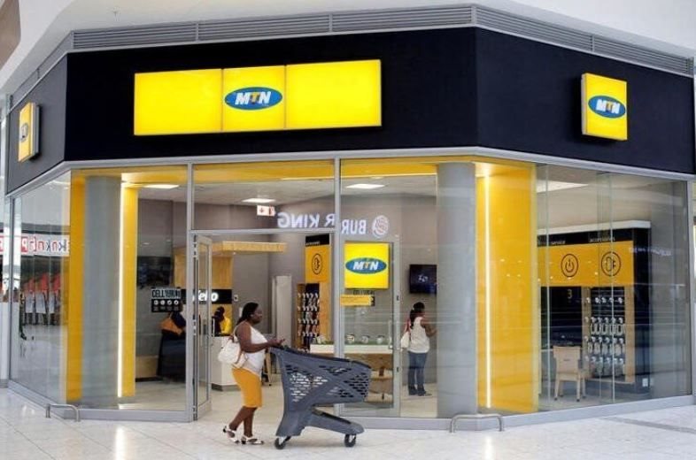 A shopper walks past an MTN shop at a mall in Johannesburg, South Africa. Reuters/Siphiwe Sibeko/File Photo