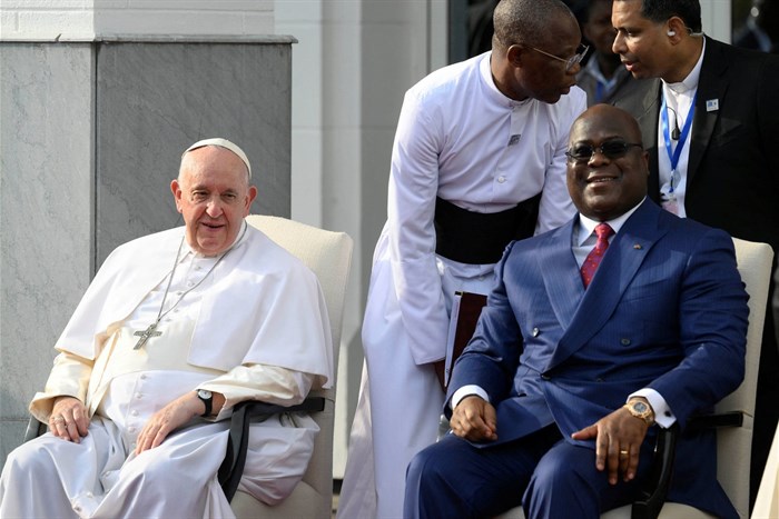 Pope Francis sits next to Democratic Republic of Congo's President Felix Tshisekedi as he attends the welcoming ceremony at the Palais de la Nation on the first day of his apostolic journey, in Kinshasa, Democratic Republic of Congo, 31 January 2023. Simone Risoluti/Vatican Media/Handout via Reuters