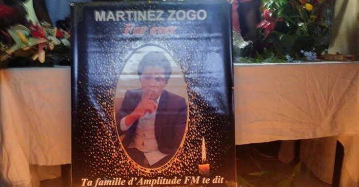 Cameroon journalist Martinez Zogo's photo is displayed as fellow journalists pay their last respect to him. Source: Reuters/Amindeh Blaise Atabong.