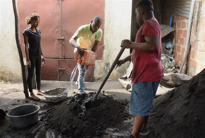 Roland Adjovi, a producer of Ecolo coal, transforms plant waste into bio charcoal at his workshop in Cotonou, Benin, 27 January 2023. Reuters/Charles Placide Tossou