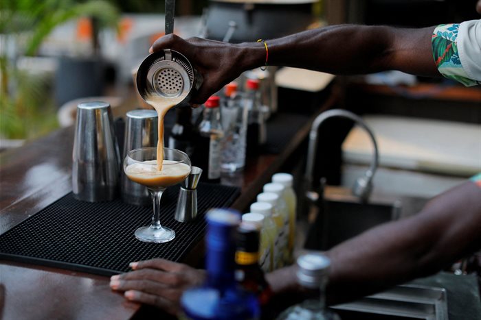 A mixologist prepares a glass of espresso martini at a bar in Accra, Ghana. Source: Reuters/Francis Kokoroko