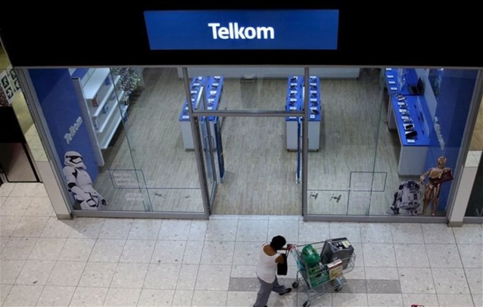 A shopper walks past a Telkom shop at a mall in Johannesburg, File. Reuters/Siphiwe Sibeko