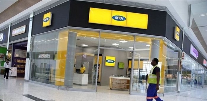 A worker walks past an outlet of South Africa's MTN Group in Johannesburg, South Africa, on 23 February 2016. Reuters/Siphiwe Sibek/File Photo