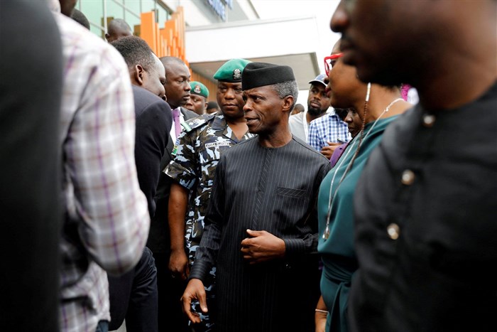Nigeria's Vice-President Yemi Osinbajo speaks with youths as he prepares to leave the venue of the launch of Google free wifi project in Lagos, Nigeria on 26 July 2018. Reuters/Akintunde Akinleye