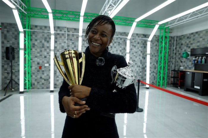 Fatumata Bah, 42, a former banker and race driver, who participated in Dakar's first Grand, which she won, holds her trophies during the trophy ceremony in Dakar, Senegal on 25 February 2023. Reuters/Zohra Bensemra