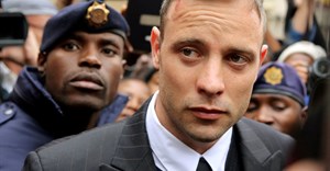 FILE PHOTO: Olympic and Paralympic track star Oscar Pistorius leaves court after appearing for the 2013 killing of his girlfriend Reeva Steenkamp in the North Gauteng High Court in Pretoria, South Africa, 14 June 2016. Reuters/Siphiwe Sibeko/Files