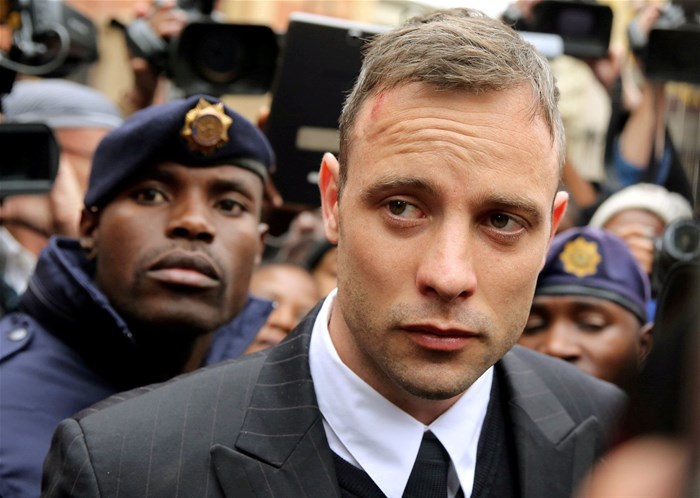 FILE PHOTO: Olympic and Paralympic track star Oscar Pistorius leaves court after appearing for the 2013 killing of his girlfriend Reeva Steenkamp in the North Gauteng High Court in Pretoria, South Africa, 14 June 2016. Reuters/Siphiwe Sibeko/Files