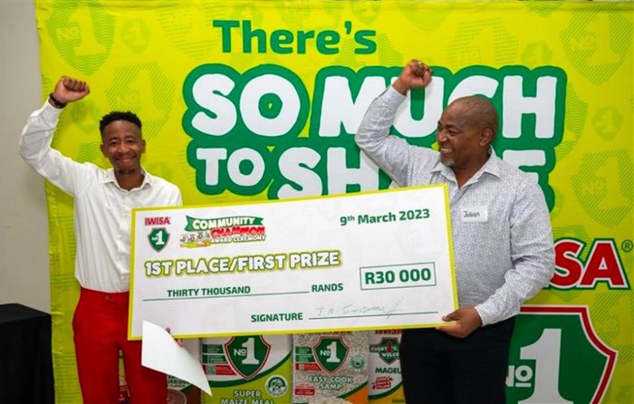 Pule Monare (left), winner of the Iwisa No.1 Community Champion Competition, celebrating his victory with Julian Singonzo (right) from Premier FMCG.