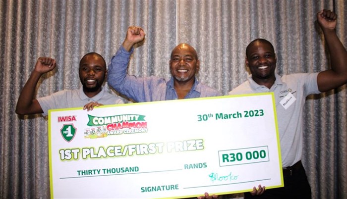 Left to right: Fortune Hadebe, Julian Singonzo and Mzokhona Maxase celebrate Cubic38 winning the Iwisa No.1 2022 Community Champion Competition.