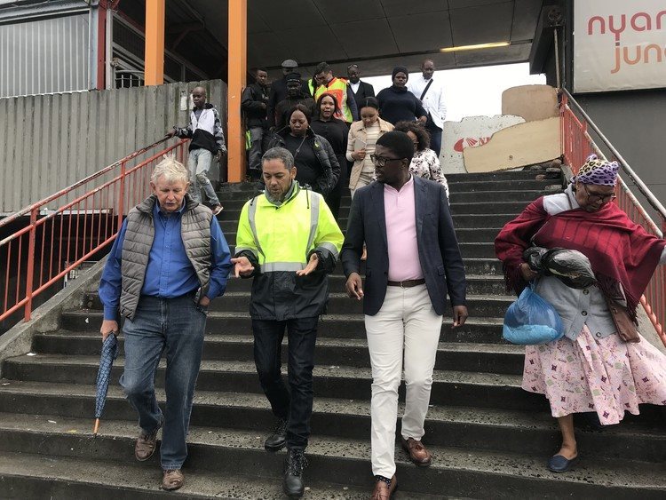 Scopa MP Robert Lees, Prasa CEO Hishaam Emeran (centre) and Scopa chairperson Mkhuleko Hlengwa (right) walk with the delegation through the train station in Nyanga on Thursday.