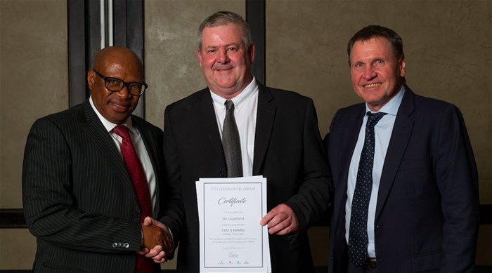 CLHG Hotelier of the Year Ian Laughland, centre, with chairman Bulelani Ngcuka, left, and CEO Andrew Widegger, right