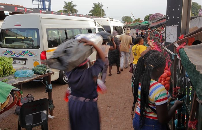Communters at a taxi station in Thohoyandou. Source: , , via Wikimedia Commons
