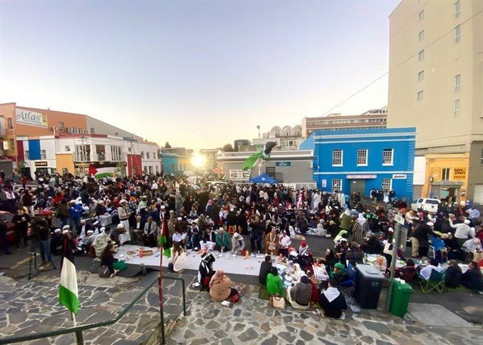 Bo-Kaap residents, who have raised concerns over lack of public participation in the City of Cape Town’s Local Spatial Development Framework for their suburb, here participate in a mass boeka (communal dinner) during Ramadan. Photo: Matthew Hirsch