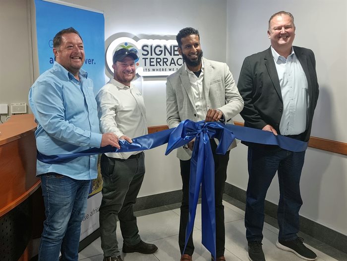 L-R: Ed Young (One Stop Solar), Jacques Roets (Nuvo Energy), Kavi Naidoo (Signet Terrace) and Sakkie van Wijk (Solarise Africa) cut the ribbon at Signet Terrace Shopping Centre's commissioning and inauguration of its solar plant.