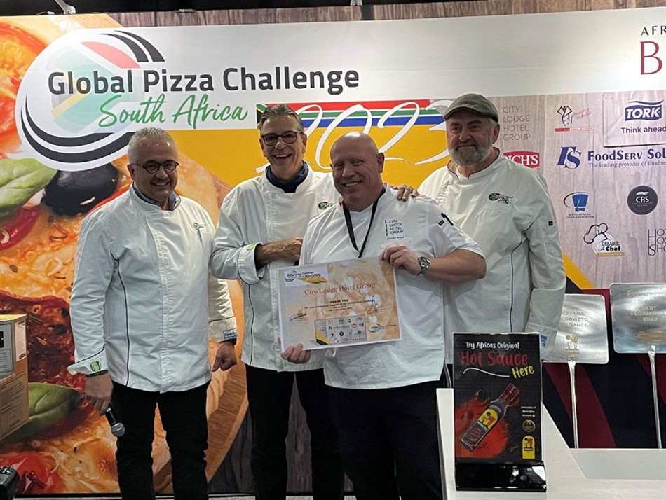 Global Pizza Challenge organisers Martin Kobald and Glenn McGinn, far left, and Jeff Schueremans, far right, hand sponsorship certificate to Trevor Boyd, City Lodge Hotels general manager operations F&B (second right).