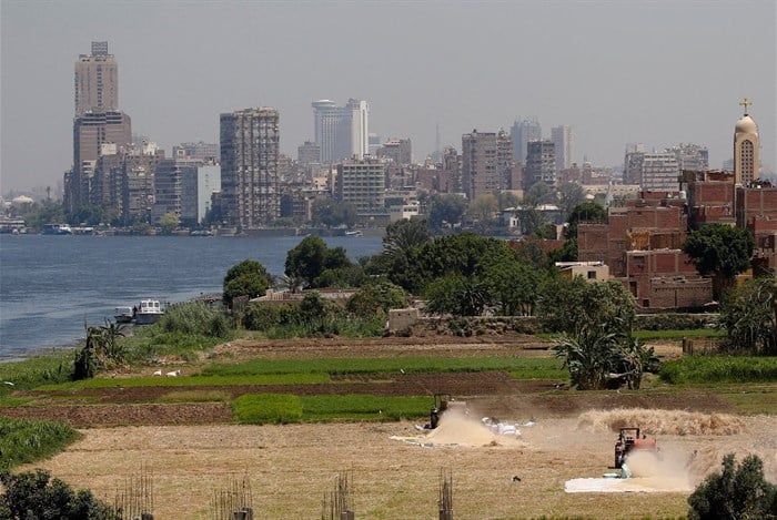 File photo: Farmers use a threshing machine as they harvest their wheat crop at a farmland on an island on the River Nile next to the capital city of Cairo, Egypt 11 May 2023. Reuters/Amr Abdallah Dalsh/File Photo