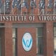Source: Security personnel keep watch outside the Wuhan Institute of Virology during the visit by the World Health Organization (WHO) team tasked with investigating the origins of the coronavirus disease, in Wuhan, Hubei province, China February 3, 2021.