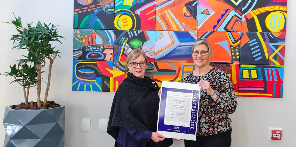 Cohsasa CEO, Jacqui Stewart hands over the accreditation certificate to Ezette van Brakel, hospital manager of Cure Day Hospital Bellville
