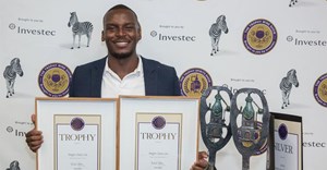 Njabulo Phewane from KWV with trophies for Best Distilled Gin and Best Gin of Show for Imagin Classic. Source: Supplied.