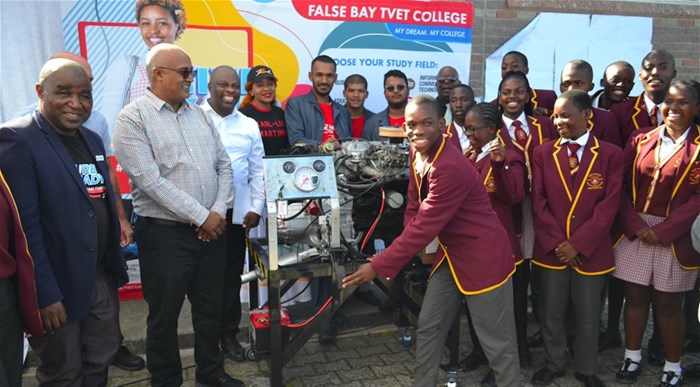 Joe Slovo learners and staff receive the refurbished engine from False Bay TVET College staff