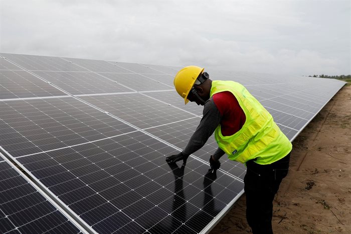A technician works on solar power panels at the Atlantic Shrimpers farm in Badagry, Lagos, Nigeria. 2022. Source: Reuters/Temilade Adelaja
