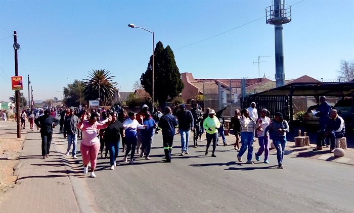 Hundreds of residents of Kagiso on the West Rand protested over unemployment and illegal mining at an old mine recently acquired by Pan African Resources. Source: Chris Gilili/GroundUp
