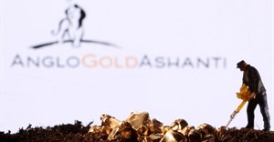 A small toy figure and gold imitation are seen in front of the AngloGold Ashanti logo in this illustration taken November 2021. Source: Reuters/Dado Ruvic