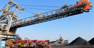 One of the two new rail-mounted stacker reclaimers which scoop up and transfer coal into and out of the yard is seen at Africa's largest coal export facility, the Richards Bay Coal Terminal, 2018. Source: Reuters/Tanisha Heiberg