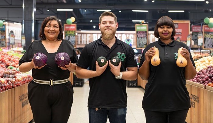 Leillani Geduld of CANSA and the team from Food Lover's Market Bothasig, Luan Meyer and Nqabisa Zwazi pose for the Check Them Out campaign. Image supplied.