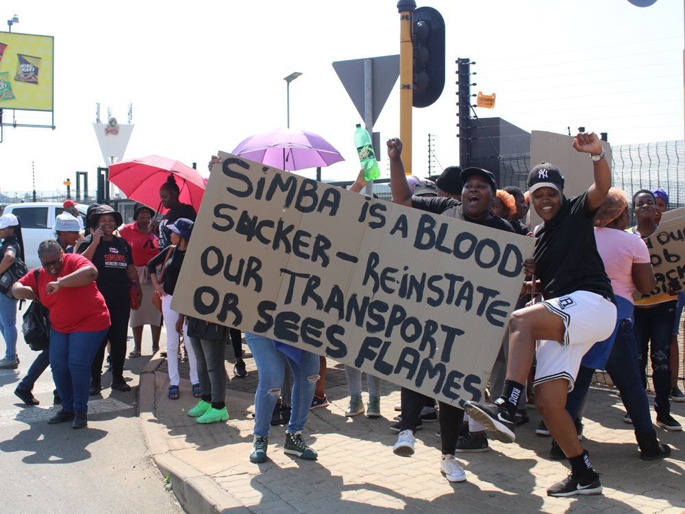 Striking Simba workers protest outside after they were prevented from leaving the premises for a couple of hours on Wednesday. The company is in court to interdict any further strike action. Photos: Kimberly Mutandiro | GroundUp