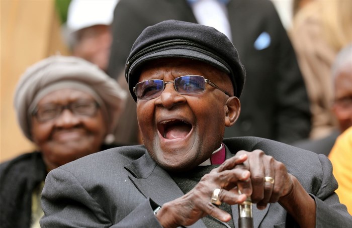 Archbishop Desmond Tutu laughs as crowds gather to celebrate his birthday by unveiling an arch in his honour outside St George's Cathedral in Cape Town, South Africa on 7 October 2017. Reuters/Mike Hutchings/File Photo