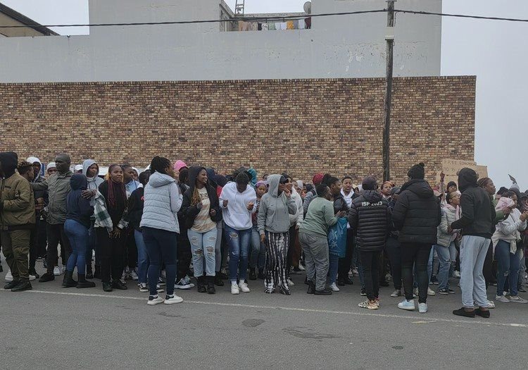 Walter Sisulu University students picket outside the East London Magistrate’s Court on Wednesday where more than 80 students were detained after protesting for unpaid NSFAS allowances. Photo: Johnnie Isaac