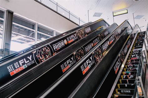 Spar takes over OR Tambo International Airport with branded escalators