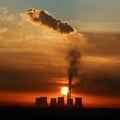 Sun rises behind the cooling towers of Kendal Power Station as the Eskom's ageing coal-fired plants cause frequent power outages, near Witbank. Source: Reuters/Siphiwe Sibeko