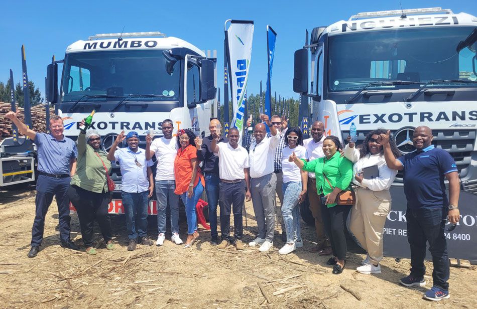 Smiles all around as the Sappi and IDFC teams congratulate Sanele on the acquisition of the new trucks.
