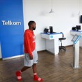 A shopper arrives at a branch of South Africa's mobile operator Telkom at the Trade Route Mall, in Lenasia outside Johannesburg. Source: Reuters/Siphiwe Sibeko