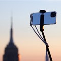 A smartphone is seen on a selfie stick in Manhattan, in New York City. Source: Reuters/Andrew Kelly