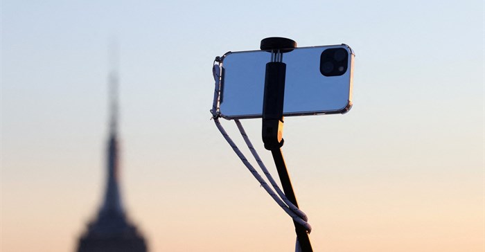 A smartphone is seen on a selfie stick in Manhattan, in New York City. Source: Reuters/Andrew Kelly
