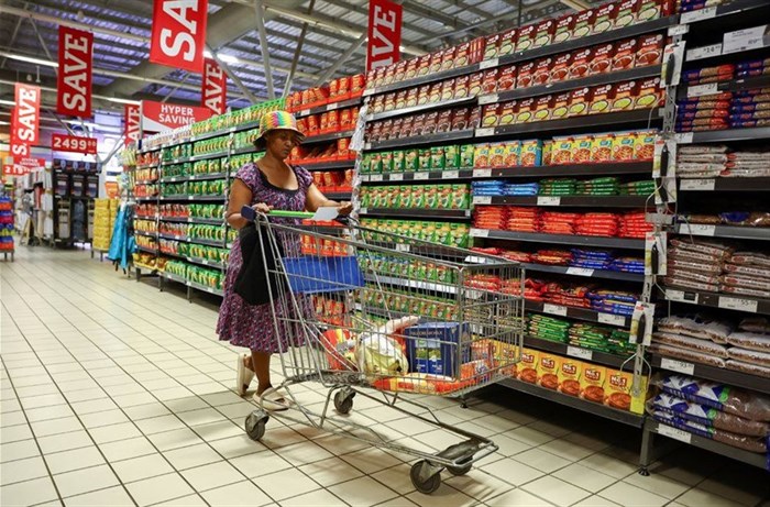 A woman uses a trolley as she shops at a Pick n Pay store at Maponya mall in Soweto, South Africa. Source: Reuters/Siphiwe Sibeko