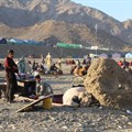 File photo: Afghan nationals rest at a camp after returning from Pakistan at the Torkham border crossing between Pakistan and Afghanistan, 14 November 2023. Abdul Khaliq Sediqi/International Rescue Committee (IRC)/ Handout via Reuters/ File photo