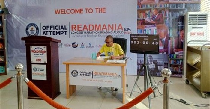 Image supplied. John Obot's attempt to shatter the 124-hour reading marathon record by reading for 145 hours.
